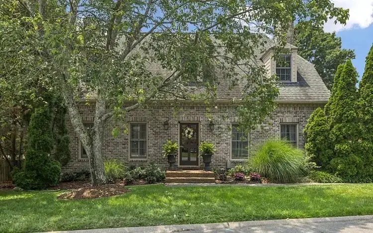 Traditional brick home with freshly painted trim in established Nashville neighborhood