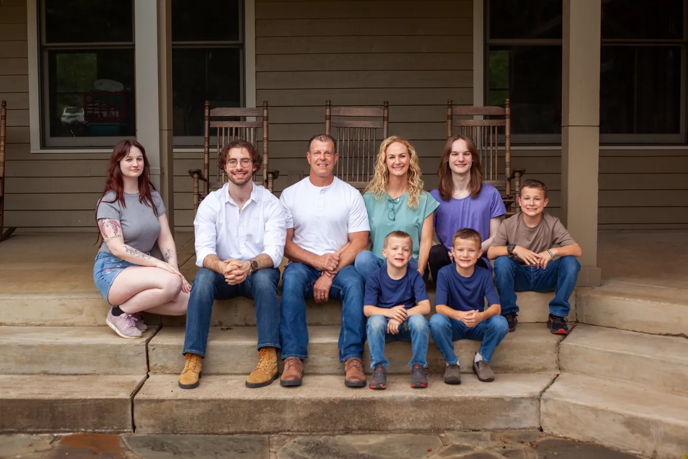 Alan and Beth Robinson with their six children on the front porch of their Nashville-area home
